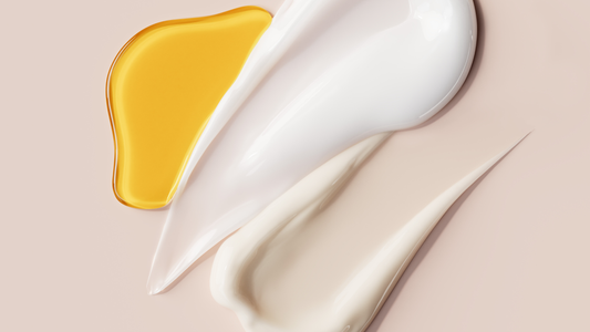 swipe of oil next to swipe of lotion