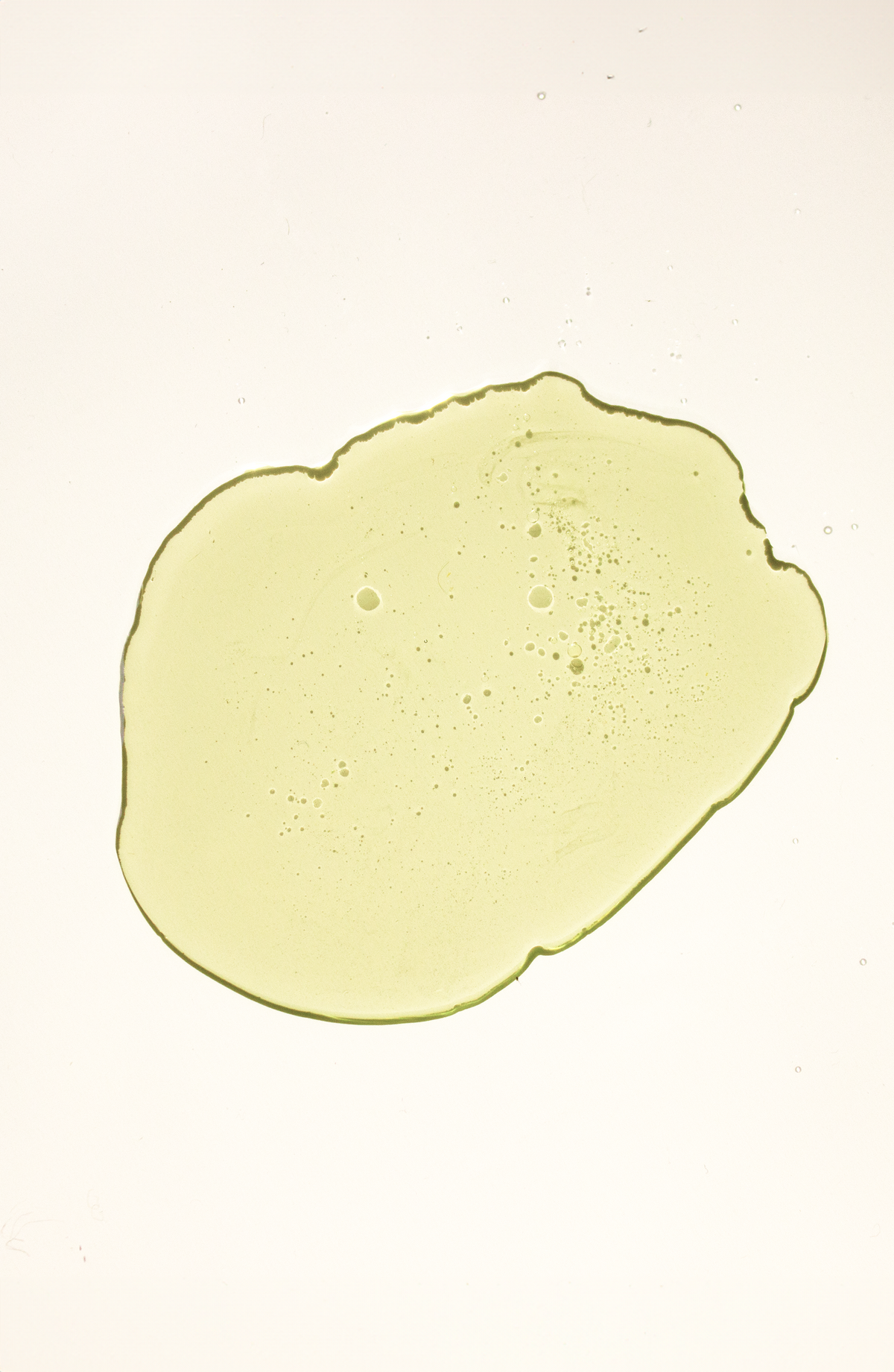 Texture shot of the Shanta Baby Oil against the ivory background